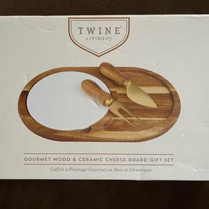 NWOT. Gourmet wood and ceramic cheese board and knives. Unopened. Never used.